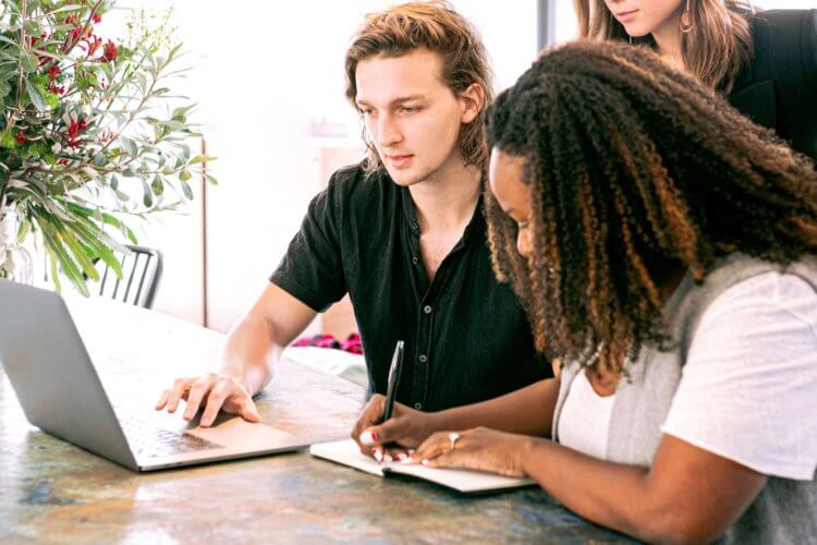 A legal professional working with a digital marketer A legal professional working with a digital marketer