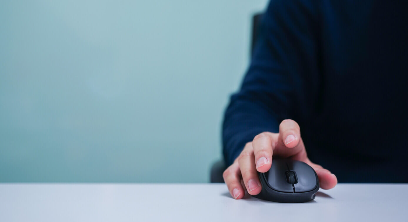 Hand on computer mouse