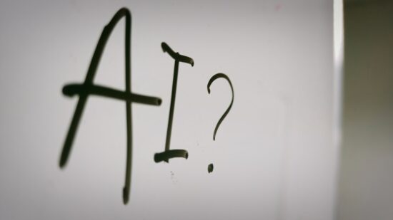 The word "AI" written on whiteboard.