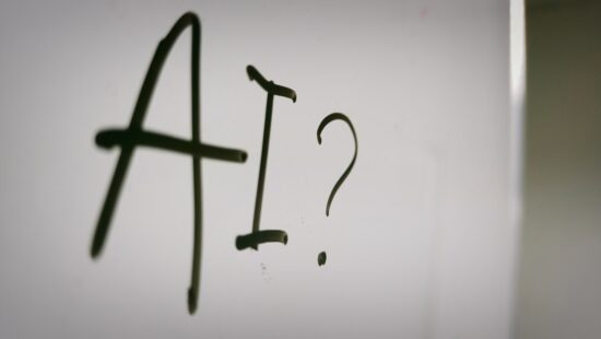 The word "AI" written on whiteboard.